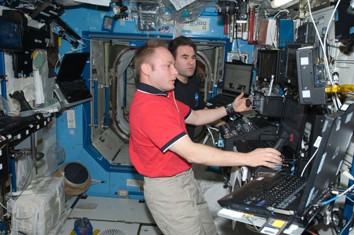 ISS Expedition 18 Crew in US Laboratory during Space Station Remote Manipulator System (SSRMS) External Stowage Platform