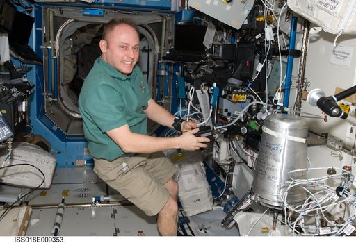 ISS Expedition 18 Fincke works with Water Recovery System (WRS)