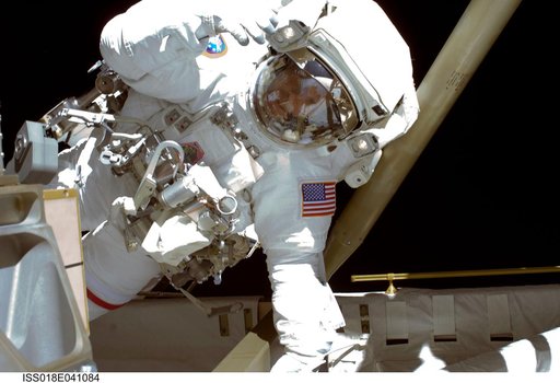 STS-119 Extravehicular Activity (EVA) 1 Swanson waves to camera