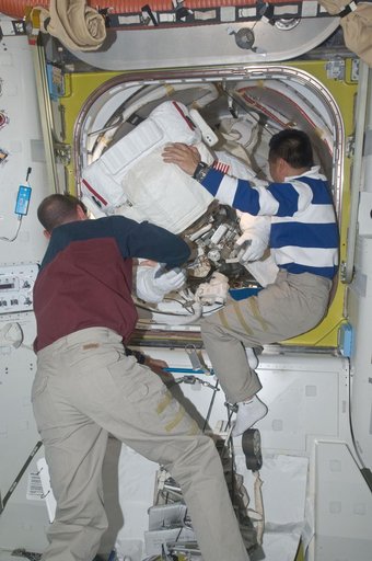STS-119 Extravehicular Activity (EVA) 2 Extravehicular Mobility Unit (EMU) Doff