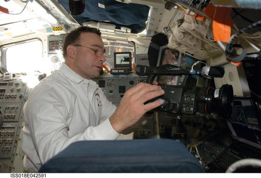 Archambault reviews procedures on Middeck (MDDK)