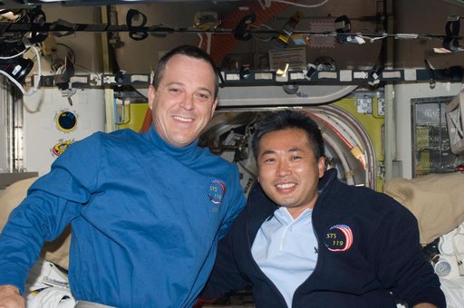 Arnold and Wakata pose in Joint Airlock Quest