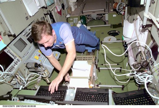 Gidzenko in Service Module with laptop computers