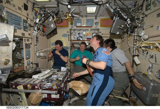Expedition 20 crew during meal in Service module