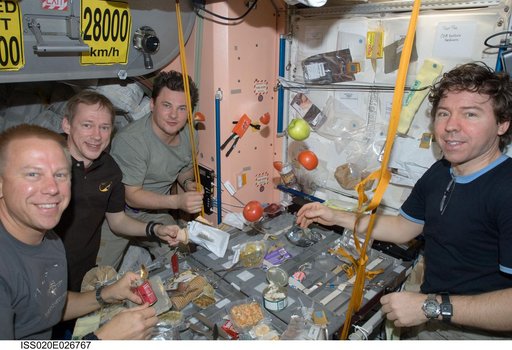 Expedition 20 crew during meal in Service Module