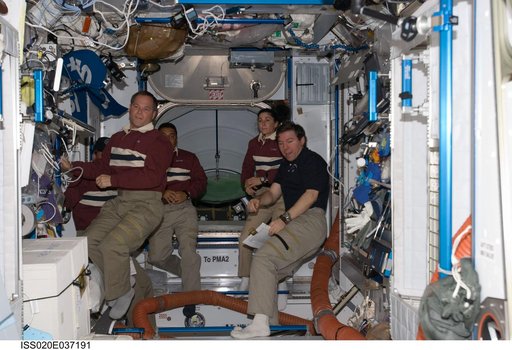 STS-128 and Expedition 20 crew in JPM