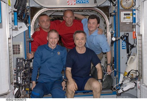 View of Expedition 21 Crew Members posing for a photo in the Node 2