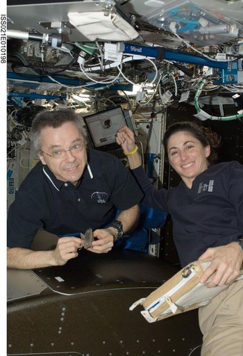 FE-4 Thirsk and FE-2 Stott pose for a photo while installing ARIS Hardware in the U.S. Laboratory