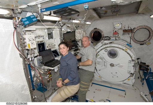 Expedition 21 Crew Members pose for a photo in the JPM