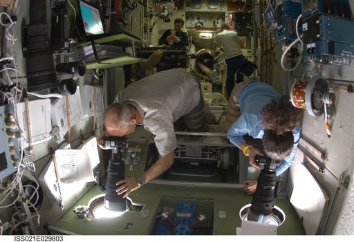 Expedition 21 Crew Members take photos in the SM