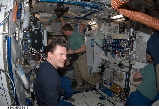 STS-129 and Expedition 21 Crew Members greet one another