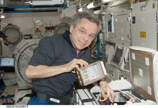Expedition 21 FE Thirsk installs the new CSI-03