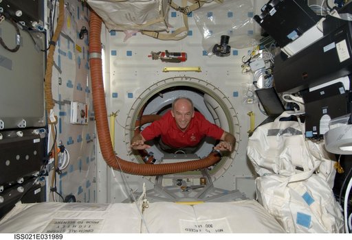 Expedition 21 FE Williams poses for a photo on the Atlantis Middeck
