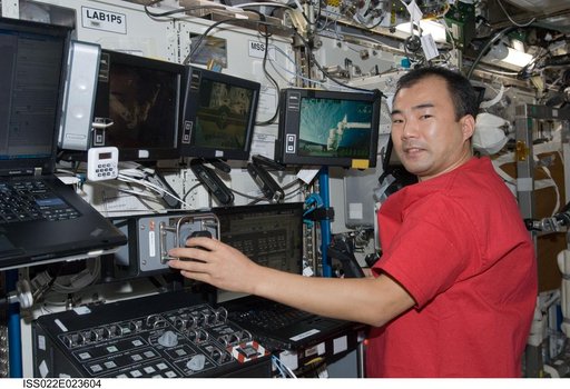 Noguchi works at Canadarm2 Workstation in the U.S. Laboratory during Expedition 22