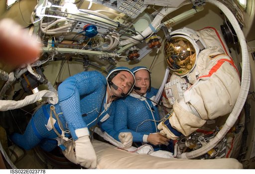 Suraev and Kotov wearing LCVG in the Pirs DC-1 during Expedition 22