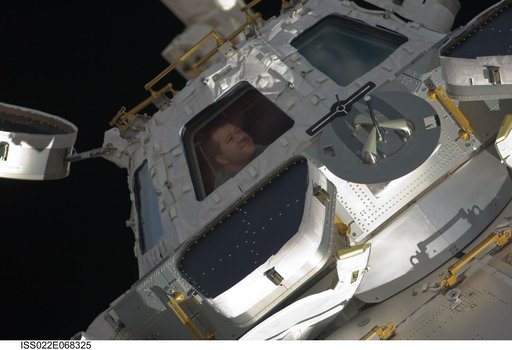 Patrick at the Cupola Module window during Joint Operations