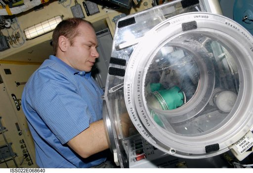 Kotov works with samples from the Bioscience Experiment ASEPTIC during Joint Operations