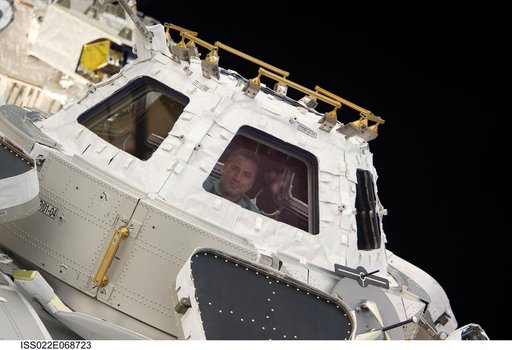 Zamka at window in the Cupola Module during Joint Operations