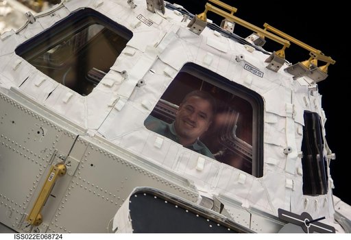 Zamka at window in the Cupola Module during Joint Operations