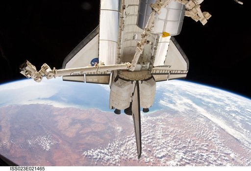 Docked Discovery over Australia