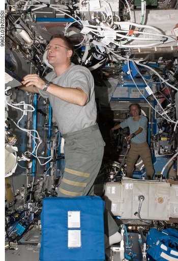 View of FE Wheelock and FE Walker working in the US Lab