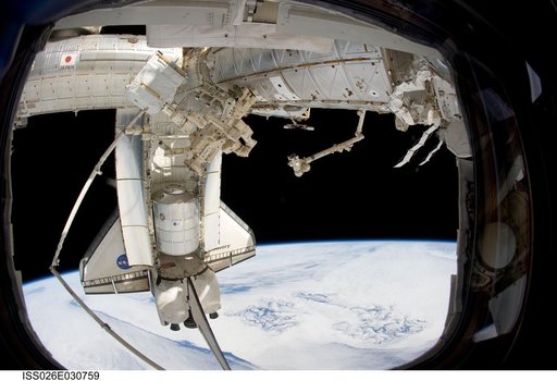 STS-133 Space Shuttle Discovery and DEXTRE
