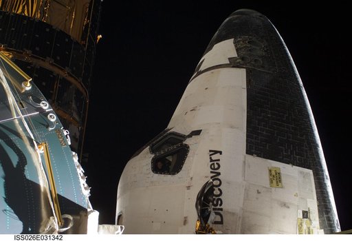 Columbus Module and STS-133 Space Shuttle Discovery FWD Cabin during EVA