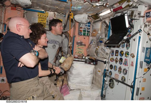 Expedition 26 and STS-133 Crewmembers watching monitor