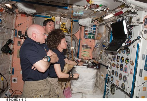 Expedition 26 and STS-133 Crewmembers watching monitor