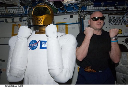 Kelly poses with Robonaut 2 in the U.S. Laboratory