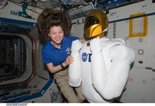 Coleman poses with Robonaut 2