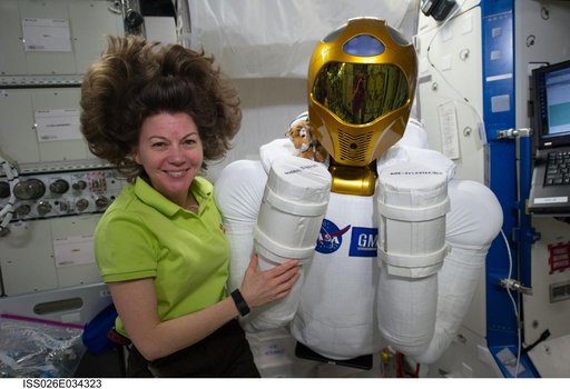 Coleman poses with Robonaut 2 in the U.S. Laboratory
