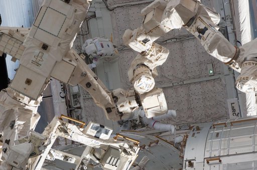 Chamitoff and Feustel in the Endeavour Payload Bay during EVA 1