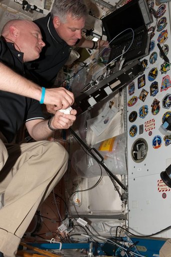 Kelly and Johnson with Mission Patches in Node 1