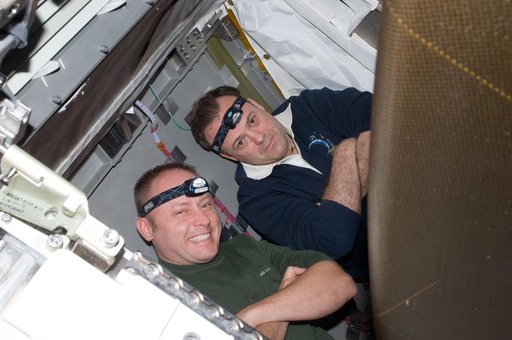 View of STS-134 MS Fincke and Expedition 28 FE Garan posing for a photo during Joint Operations