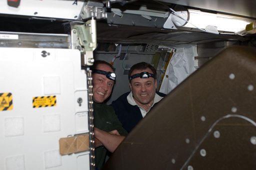 View of STS-134 MS Fincke and Expedition 28 FE Garan posing for a photo during Joint Operations