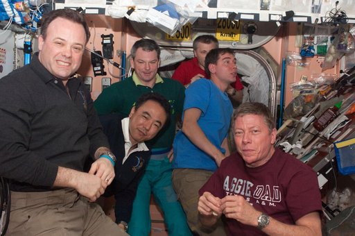 Expedition 28 crew members enjoy dinner in the Node 1