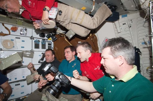 STS-135/Expedition 28 Crew Members in Shuttle Middeck