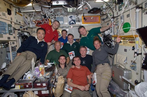 Expedition 28 and STS-135 Crew Members pose for a photo Crew Portrait
