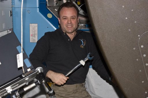 Expedition 28 FE Garan poses for a photo in the US Lab