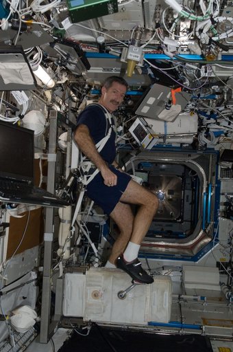 Burbank exercises on the CEVIS in the U.S. Laboratory