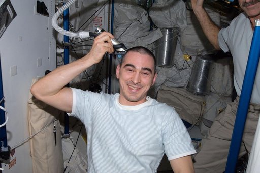 Ivanishin trims his hair in the Node 3