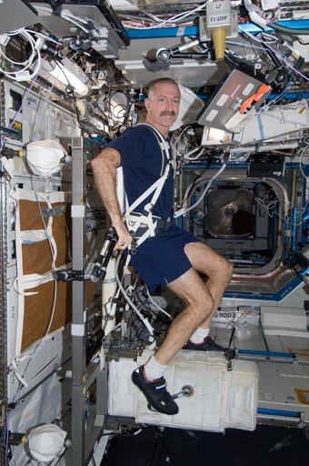 Burbank exercises on the CEVIS in the U.S. Lab