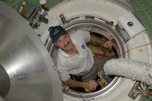 Burbank exits the MRM1 hatch area into the FGB Transfer Compartment