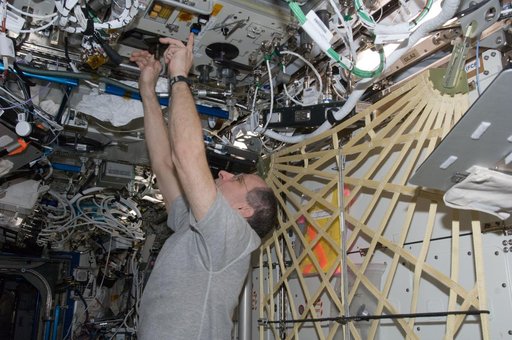 Pettit performs an in-flight maintenenace on the PWD in the U.S. Laboratory