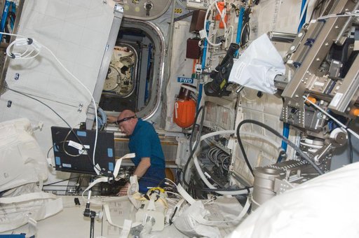 Kuipers conducts maintenance in the Columbus Module