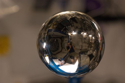 Water Bubble revealing a refracted image of ESA Andre Kuipers