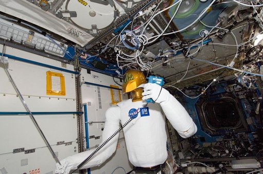 Robonaut 2 Humanoid Robot holds instrument to measure air velocity