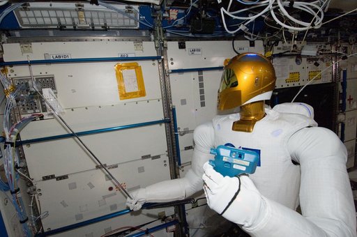 Robonaut 2 Humanoid Robot holds instrument to measure air velocity
