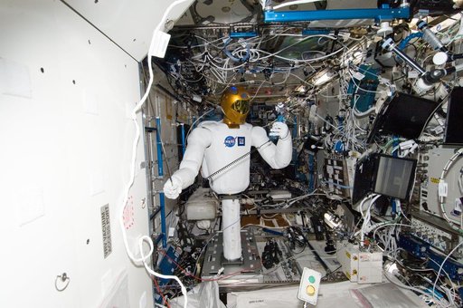 Robonaut 2 Humanoid Robot holds instrument to measure air velocity